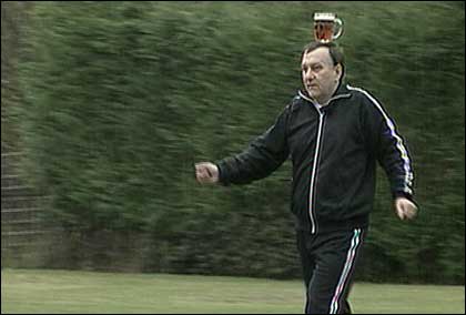 Danny Lee balancing a pint on his head