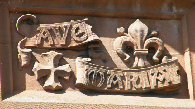 Ave Maria carved in the sandstone over the door of the convent. (Latin for Hail Mary)