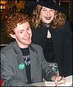 Pic: Chris Rankin signs a copy of the book.