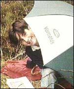John  Paul under an umbrella