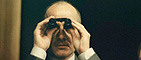 Our Predictions: Man with binoculars