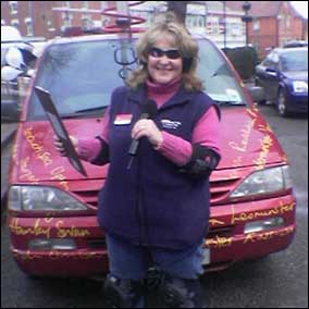 Katie Johnson standing in front of the BBC H&W car