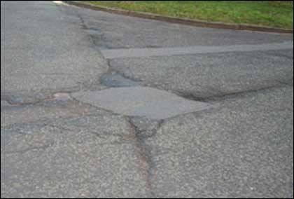 Pothole in the road in Redditch by Ahsan Ahmed