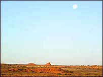 Picture: Moon sits above canyons