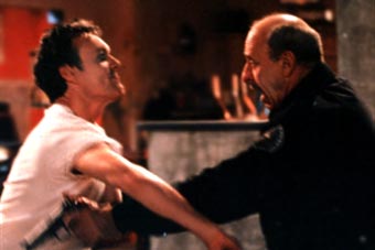 Go on my son, 'it 'im! Giles gets a bit violent.