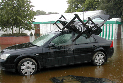 Car left in New Road floods