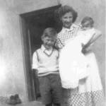 The firm bond that began during the war has continued through the years.  Here, in 1950 Patricia returns to visit, for the christening of Pamela Cole, Micheal's baby sister.  Michael pictured age 7