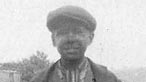 Black and white image of a young miner at the turn of the 20th century