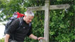 Derek crossing over a wooden style 
