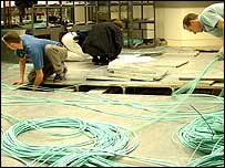 Pic: Workmen install cable.