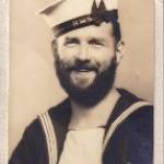 "Victory Postcard" in the form of a photograph of William Arthur  Robinson (Bill) sporting a "full set" and sent to his wife, Kathleen, from Australia.