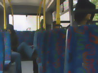 Hooded youth on bus