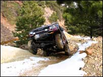 Picture: Land Cruiser lifting a wheel off the track