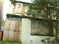 Boarded up house
