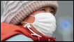 A girl wearing a mask
