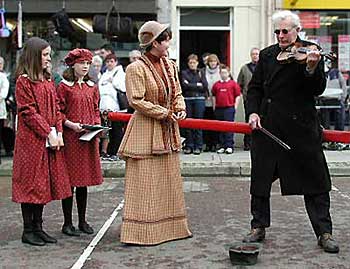 Jane Ross and her students greet the blind fiddler