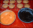 Picture: Split the icing into two bowls and colour with food colouring