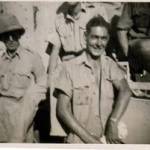 Smudge & Jack Burgin propping up a roving General Grant tank at El Khanka - September 1942.  The driver had lost his way and came to ask us where he was.