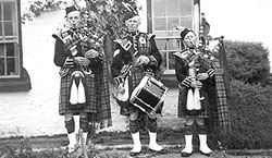 three members of the Bellanaleck Pipe Band