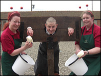 Melanie Bayley and Kate Vaughan get ready to pelt James Moore with sponges.