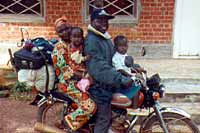 A whole family sets out on a journey on a small motorbike