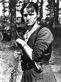 Image of a female Resistance fighter in France, 1942 with a rifle