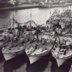 This picture was taken by me from the top of the water tower at Great Yarmouth. it shows the 63rd Motor Torpedo Boat flotilla dressed to celebrate VE Day. MTB 753 is the boat tied up alongside the jetty, with some of my shipmates on the fo'c'sle. This picture was taken by me from the top of the water tower at Great Yarmouth. it shows the 63rd Motor Torpedo Boat flotilla dressed to celebrate VE Day. MTB 753 is the boat tied up alongside the jetty, with some of my shipmates on the fo'c'sle.