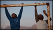 Boys play on a football goal