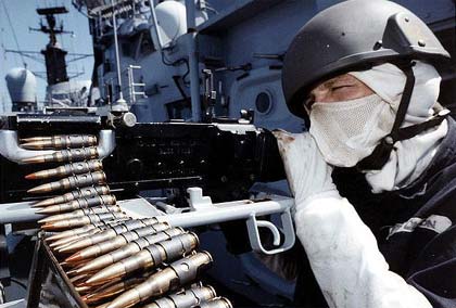man aiming gun