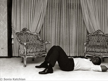 Muhammed Ali asleep on the floor - photo by Sonia Katchian