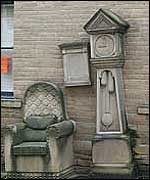 stone chair and clock in Bradford