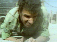Photograph showing an Iraqi soldier as he takes cover, during the Gulf War