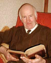 Sam Carrothers studies the Family Bible