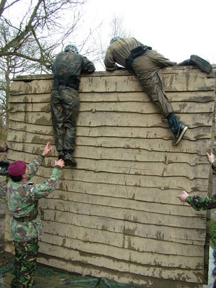 The team scale the wall