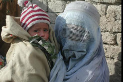 An Afghan woman and her child