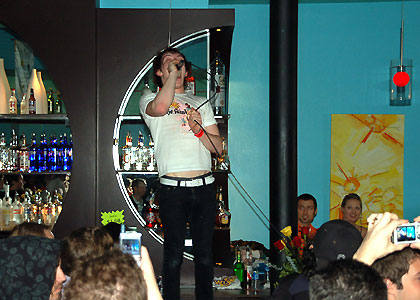 ...then takes to the bar...