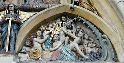 Close up of purgatory panel. Judgement Day carving above entrance door of St Michael's, Enniskillen