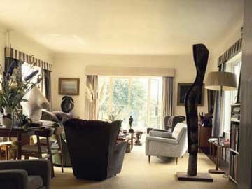 The large sitting room in the Summer of 1967 photo by John Hedgecoe most of the objects shown are on loan from the Henry Moore Family Collection. © The Henry Moore Foundation. This image must not be reproduced or altered without prior consent from the Henry Moore Foundation.