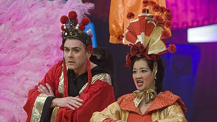 Chris Jarvis as Emperor Sho Mee and Pui Fan Lee as Empress Sho Mee