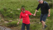 Derek and guide cross the stream