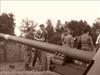 WWII soliders next to heavy guns