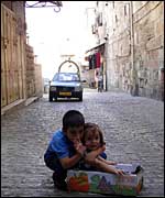 Palestinian children playing in the narrow streets