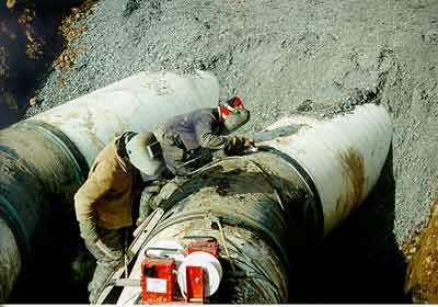 Water pipes being welded together before being buried for perhaps the next hundred years?