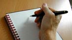 A note pad and pen