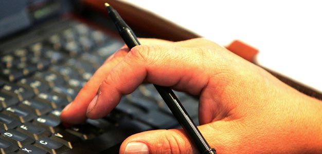 A laptop and pen.