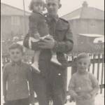 Possibly Middleburg Street, East Hull.  George with his 3 children.