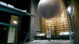 A Torchwood scientist, Dr. Singh, looks upon a mysterious sphere .