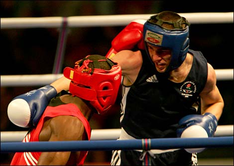 Herbert Nkabiti (L) of Botswana exchanges punches 