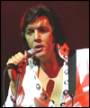 Richard Atkins as Elvis captured on stage  in Truro