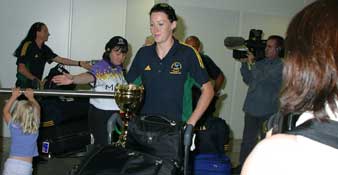 Jana Pittman arrives, assisted by volunteer